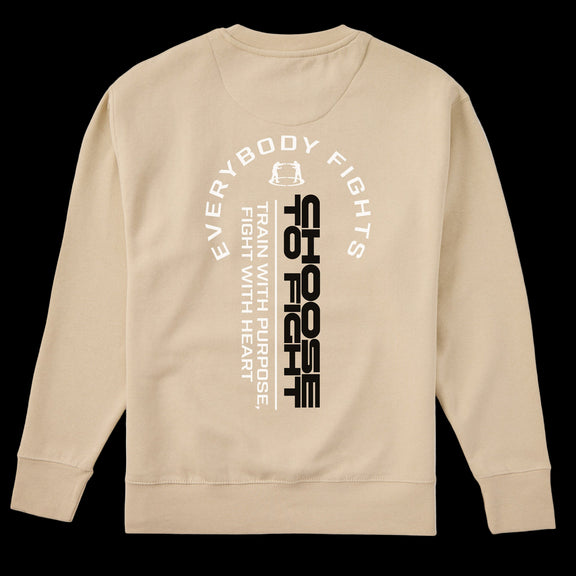 Beige sweatshirt with motivational text design on a white background